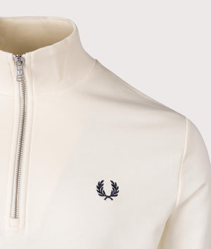 Fred Perry Quarter Zip Sweatshirt in Ecru/Tennis Blue. Shot at EQVVS.  Detail shot. 