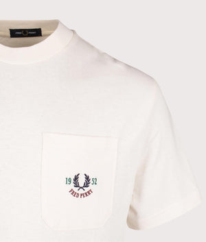 Fred Perry Relaxed 1952 T-shirt in Ecru, 100% cotton at EQVVS. Detailed logo shot. 