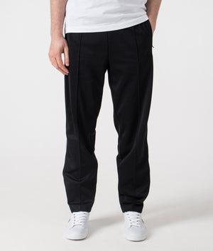 Fred Perry Two Colour Tape Track Pants in Black. Shot at EQVVS.  Front shot. 