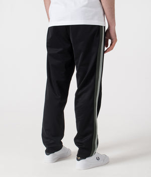 Fred Perry Two Colour Tape Track Pants in Black. Shot at EQVVS.  Back shot. 