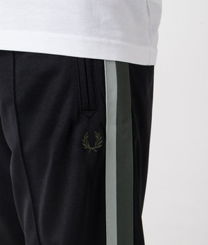 Fred Perry Two Colour Tape Track Pants in Black. Shot at EQVVS.  Detail shot. 