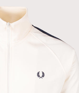 Fred Perry Contrast Tape Track Jacket in Ecru/Tennis Blue at EQVVS. Detailed logo shot.