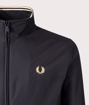 Fred Perry Brentham Jacket in Black at EQVVS Menswear. Detailed logo shot. 