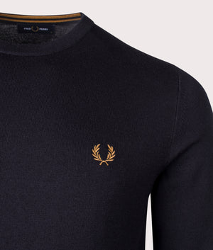 Fred Perry Classic Crew Neck Jumper in Navy, 54% Merino Wool, 46% Cotton at EQVVS. Detailed logo shot. 