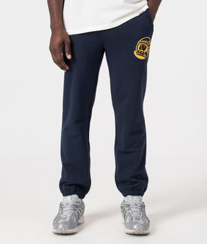 Billionaire Boy's Club Helmet Logo Joggers in Navy. Front angle model shot at EQVVS