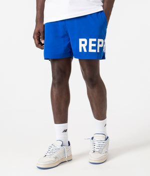 Regular Fit Represent Swim Shorts in Cobalt by Represent. EQVVS Side Angle Shot. 