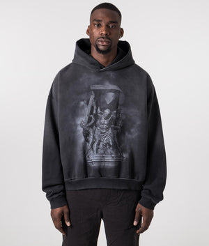 Atlas Hoodie in Stained Black by Represent with chest and back print. EQVVS Model Shot. 