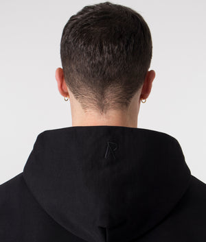 Initial Zip Through Hoodie in Black by REPRESENT. Shot at EQVVS. Detail shot. 