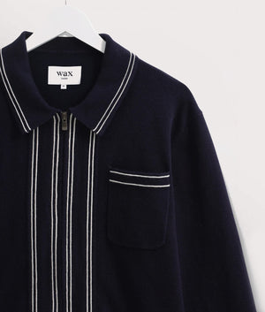 Wax London Amble Polo Shirt in Navy. Detail Shot Hanging at EQVVS 