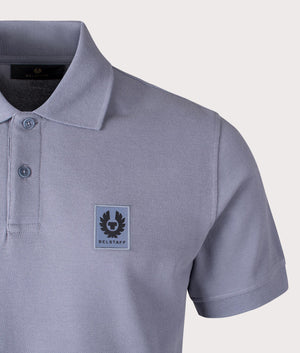 Belstaff Polo Shirt in Blue Flint, 100% Cotton. At EQVSS Menswear. Front logo shot. 