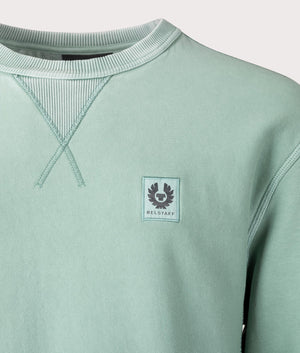 Belstaff Hockley Crewneck Sweatshirt in Oil Blue. Body 100% Cotton. At EQVSS Menswear. Front Logo Shot