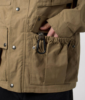 Belstaff Centenary Field Jacket in British Khaki, 100% Cotton at EQVVS. Pocket and carabener shot. 