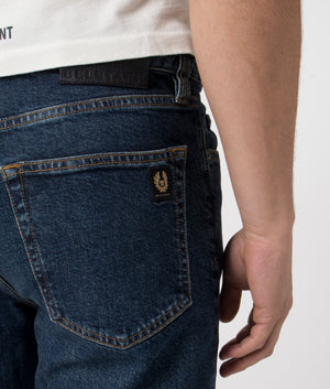 Belstaff Regular Fit Longton Jeans in Washed Indigo. At EQVVS Menswear. Rear Pocket Logo Model Shot