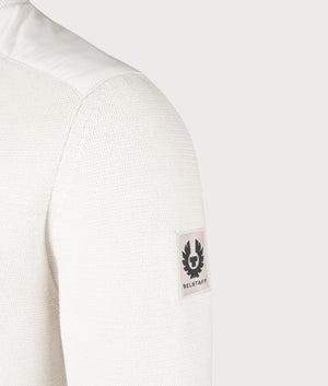 Belstaff Vertex Zip Cardigan in Stone Beige, 100% Cotton Body. At EQVVS Menswear. Front angle logo shot