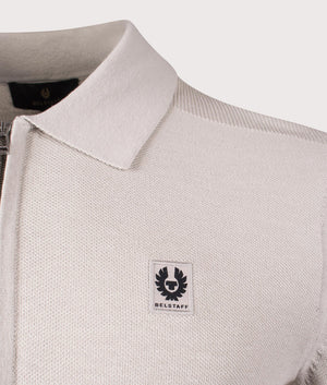 Belstaff Drift Knitted Long Sleeve Polo Shirt in Stone Beige. Shot at EQVVS. Detail shot. 