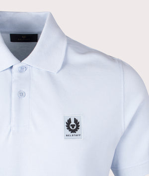 Belstaff Polo Shirt in Sky blue, 100% Cotton. At EQVSS Menswear. Front logo shot. 