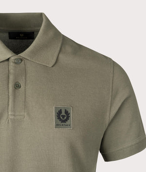 Belstaff Polo Shirt in Surplus Green, 100% Cotton. At EQVSS Menswear. Front logo shot.  