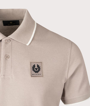 Belstaff Tipped Polo Shirt in Pumice, 100% Cotton. At EQVVS Menswear. Front logo shot.