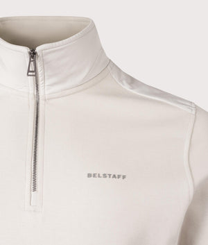 Belstaff Alloy Quarter Zip Sweatshirt in Stone Beige. Shot at EQVVS. Close up shot. 