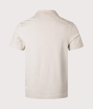 Belstaff Alloy Polo Shirt in Stone Beige. Shot at EQVVS. Back shot. 