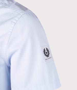 Belstaff Short Sleeve Scale Shirt in Sky Blue, 100% Cotton. At EQVVS Menswear. Front angle logo shot