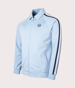 Renshaw Track Top Sergio Tacchini, celestial blue. Shot at EQVVS. Angle shot. 