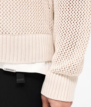 REPRESENT Open Gauge Knit Jumper in Cream Marl. Shot at EQVVS.  Detail shot. 