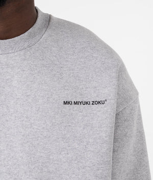 MKI Oversized Uniform Crewneck Sweatshirt in Grey. Detail angle model shot at EQVVS.