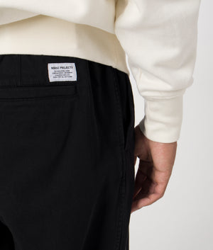 Ezra Light Stretch Trousers in Black by Norse Projects. EQVVS Menswear Detail Model Shot. 