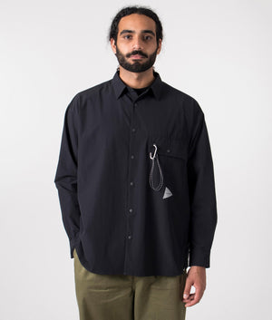 and wander lightweight cloth shirt in black. Shot at EQVVS. front model shot. 