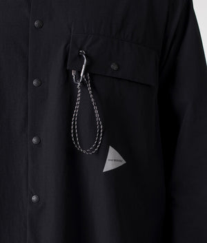 and wander lightweight cloth shirt in black. Shot at EQVVS. Detail shot. 