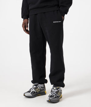 MKI Relaxed Fit Uniform Joggers in black. Side angle model shot at EQVVS.