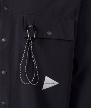 and wander lightweight cloth shirt in black. Shot at EQVVS. Detail shot. 