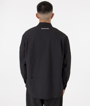 MKI Oversized Seersucker Dress Shirt in Black. Back angle model shot at EQVVS.