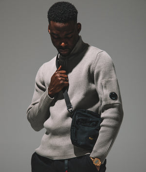 CP Company Full Rib Quarter Zip Knitted Jumper in 327 Vintage Khaki. At EQVVS Menswear. campaign shot