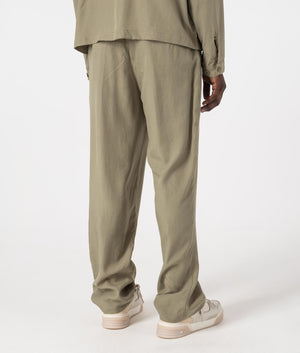 MKI Relaxed Fit Tencel Trousers in Sage Green. Back angle model shot at EQVVS.