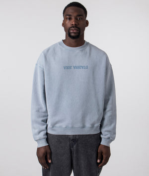 Axel Arigato Distort Washed Sweatshirt in Steel Blue. Shot at EQVVS. Front shot. 