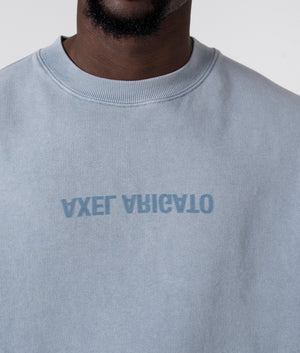 Axel Arigato Distort Washed Sweatshirt in Steel Blue. Shot at EQVVS. Detail shot. 