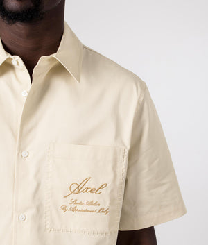 Axel Arigato Stitch Embroidered Short Sleeve Shirt in Pale Beige. Shot at EQVVS. Detail shot.