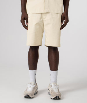 Axel Arigato Stitch Embroidered Shorts in Pale Beige. Shot at EQVVS. Front shot. 