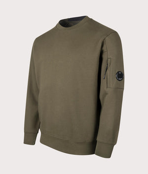 C.P. Company Diagonal Raised Sweatshirt in Ivy Green . Shot at EQVVS. Angle shot. 