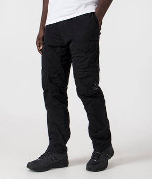 C.P. Company Chrome R Lens Cargo Pants in Black. Shot at EQVVS. Side angle shot. 