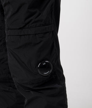 C.P. Company Chrome R Lens Cargo Pants in Black. Shot at EQVVS.  Detail shot. 