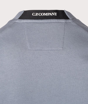 C.P. Company Diagonal Raised Lens Sweatshirt in Stormy Weather, 100% cotton at EQVVS. Back logo shot. 