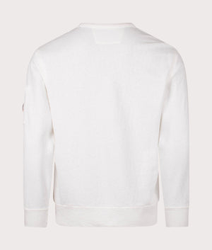 C.P. Company Lens Sleeve Crewneck Sweatshirt in Gauze White, 100% Cotton at EQVVS. Back shot. 