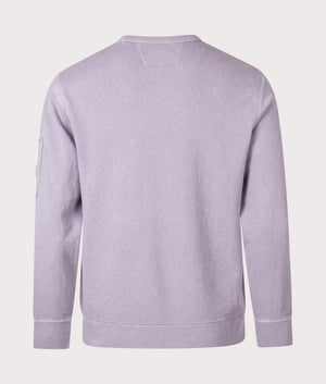 C.P. Company Lens Sleeve Crewneck Sweatshirt in Lavander Violet, 100% cotton at EQVVS. Back shot. 