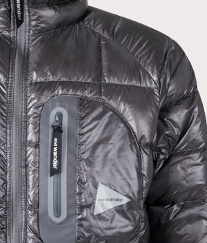 and wander diamond quilt padded jacket in grey. Shot at EQVVS. Model detail shot. 