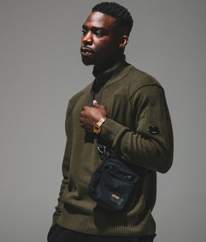 Ivy Green Lambswool Quarter Zip Jumper by C.P. Company. EQVVS. campaign shot. 