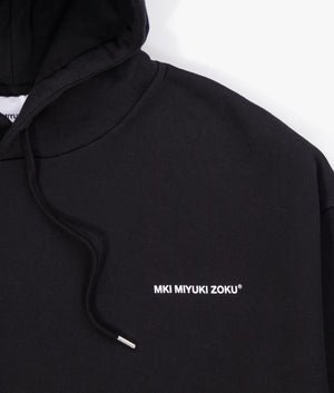 Oversized Uniform Hoodie in Black from MKI MIYUKI ZOKU. Detail shot at EQVVS.