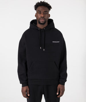 MKI Oversized Uniform Hoodie in Black. Front angle model shot at EQVVS.